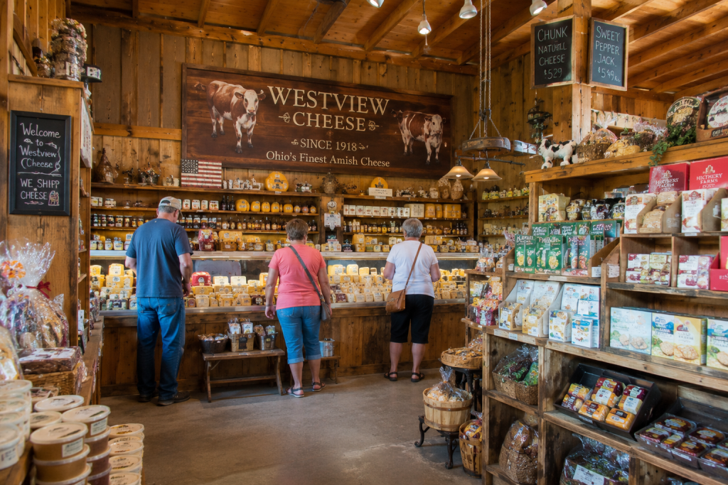 Rustic cheese shop interior in Ohio Amish Country with specialty cheese displays